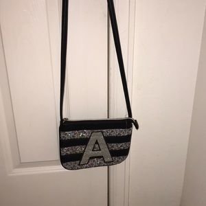 Black and silver justice cross body bag